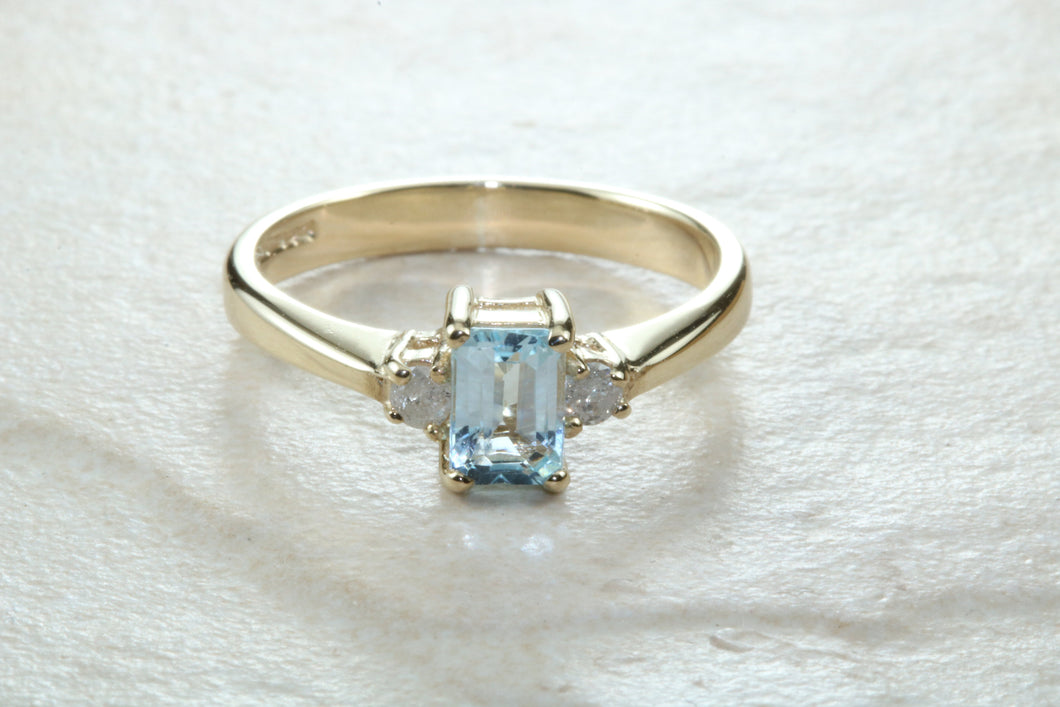 This combination of Diamond and blue Topaz trilogy ring is sure to be the gift of choice. solid 9ct yellow gold. Just the perfect gift