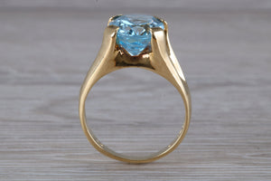 Large 9 carat Oval cut Blue Topaz set 18ct Yellow Gold Ring