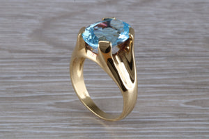 Large 9 carat Oval cut Blue Topaz set 18ct Yellow Gold Ring