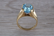 Load image into Gallery viewer, Large 9 carat Oval cut Blue Topaz set 18ct Yellow Gold Ring