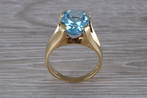 Large 9 carat Oval cut Blue Topaz set 18ct Yellow Gold Ring