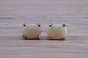 Oval cut Fiery Opal set Yellow Gold Stud Earrings