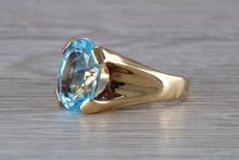 Load image into Gallery viewer, Large 9 carat Oval cut Blue Topaz set 18ct Yellow Gold Ring