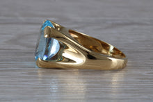 Load image into Gallery viewer, Large 9 carat Oval cut Blue Topaz set 18ct Yellow Gold Ring