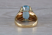 Load image into Gallery viewer, Large 9 carat Oval cut Blue Topaz set 18ct Yellow Gold Ring