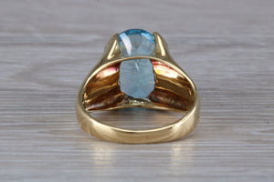 Large 9 carat Oval cut Blue Topaz set 18ct Yellow Gold Ring