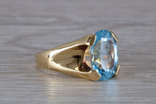 Load image into Gallery viewer, Large 9 carat Oval cut Blue Topaz set 18ct Yellow Gold Ring