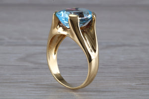 Large 9 carat Oval cut Blue Topaz set 18ct Yellow Gold Ring