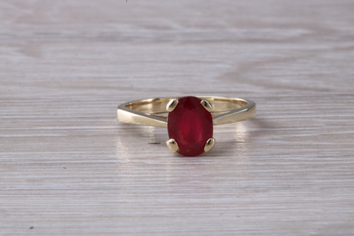 Two carat Oval cut Ruby set Yellow Gold Solitaire