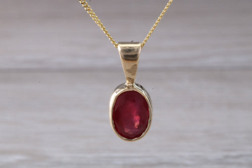 Oval cut Ruby set Yellow Gold Solitaire Necklace