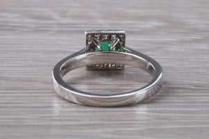 Emerald and Diamond Halo set Platinum Ring