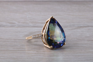 Large 13 carats Mystic Blue Topaz and Diamond set Yellow Gold Ring