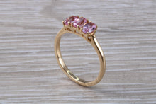 Load image into Gallery viewer, Oval Pink Topaz set Yellow Gold Trilogy Ring