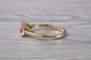 Oval Pink Topaz set Yellow Gold Trilogy Ring