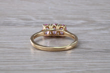 Load image into Gallery viewer, Oval Pink Topaz set Yellow Gold Trilogy Ring