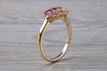 Load image into Gallery viewer, Oval Pink Topaz set Yellow Gold Trilogy Ring