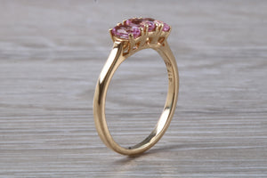 Oval Pink Topaz set Yellow Gold Trilogy Ring