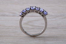 Load image into Gallery viewer, 7 stone natural Tanzanite eternity ring, oval cut Tanzanite set in 9ct white gold, one and half carats Tanzanite