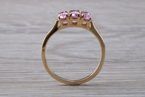 Oval Pink Topaz set Yellow Gold Trilogy Ring