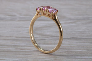 Oval Pink Topaz set Yellow Gold Trilogy Ring