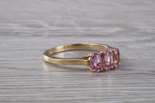 Load image into Gallery viewer, Oval Pink Topaz set Yellow Gold Trilogy Ring