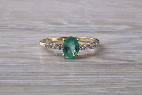 Dainty Oval cut Emerald and Diamond set Yellow Gold Ring