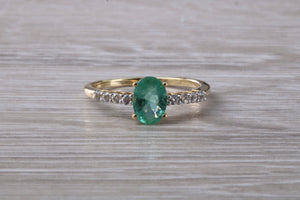 Dainty Oval cut Emerald and Diamond set Yellow Gold Ring