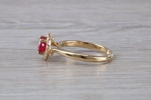 Stunning One carat Ruby and Halo set Diamond Ring