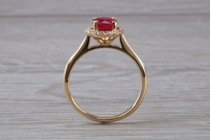 Stunning One carat Ruby and Halo set Diamond Ring