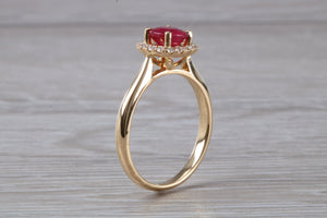 Stunning One carat Ruby and Halo set Diamond Ring