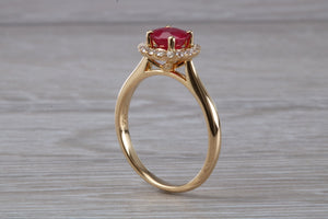 Stunning One carat Ruby and Halo set Diamond Ring