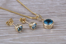 Load image into Gallery viewer, Round cut Blue Topaz Matching Earrings and Necklace set in Yellow Gold