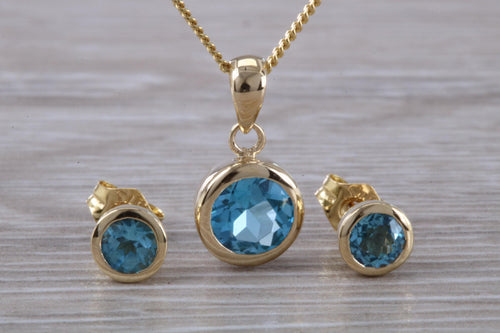 Round cut Blue Topaz Matching Earrings and Necklace set in Yellow Gold