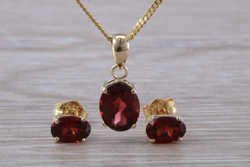 Oval cut Garnet Earrings and Matching Necklace set in Yellow Gold