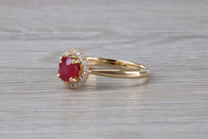 Stunning One carat Ruby and Halo set Diamond Ring