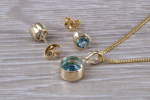 Load image into Gallery viewer, Round cut Blue Topaz Matching Earrings and Necklace set in Yellow Gold