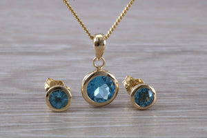 Round cut Blue Topaz Matching Earrings and Necklace set in Yellow Gold