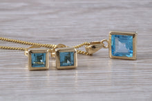 Load image into Gallery viewer, Square cut Blue Topaz Matching Earrings and Matching Necklace set in Yellow Gold