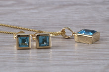 Load image into Gallery viewer, Square cut Blue Topaz Matching Earrings and Matching Necklace set in Yellow Gold