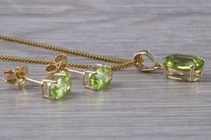 Oval cut Peridot Earrings and Matching Necklace set in Yellow Gold