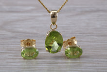 Load image into Gallery viewer, Oval cut Peridot Earrings and Matching Necklace set in Yellow Gold