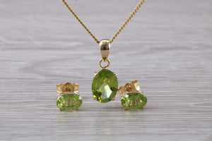 Oval cut Peridot Earrings and Matching Necklace set in Yellow Gold