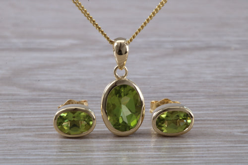 Oval cut Peridot Earrings and Matching Necklace set in Yellow Gold