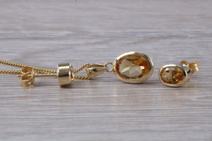 Oval cut Citrine Earrings and Matching Necklace set in Yellow Gold