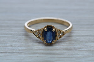 Oval cut Blue Sapphire and Diamond Ring