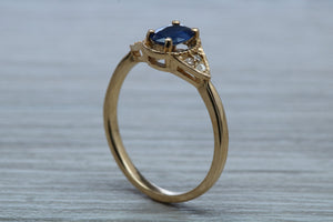 Oval cut Blue Sapphire and Diamond Ring