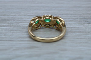 Three Emeralds and Diamonds set Yellow Gold Ring