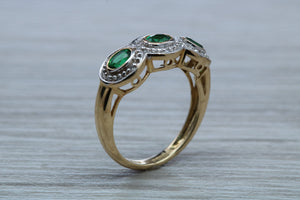 Three Emeralds and Diamonds set Yellow Gold Ring