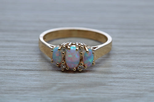 Fiery Opal and Diamonds set Yellow Gold Ring