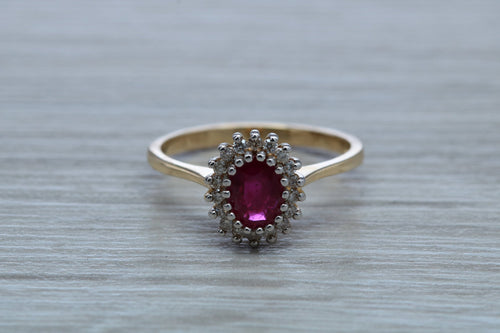Oval cut Ruby and Diamond Cluster Ring